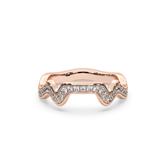 A rose gold band ring with a series of pave set diamonds creating a mountain range contour design.